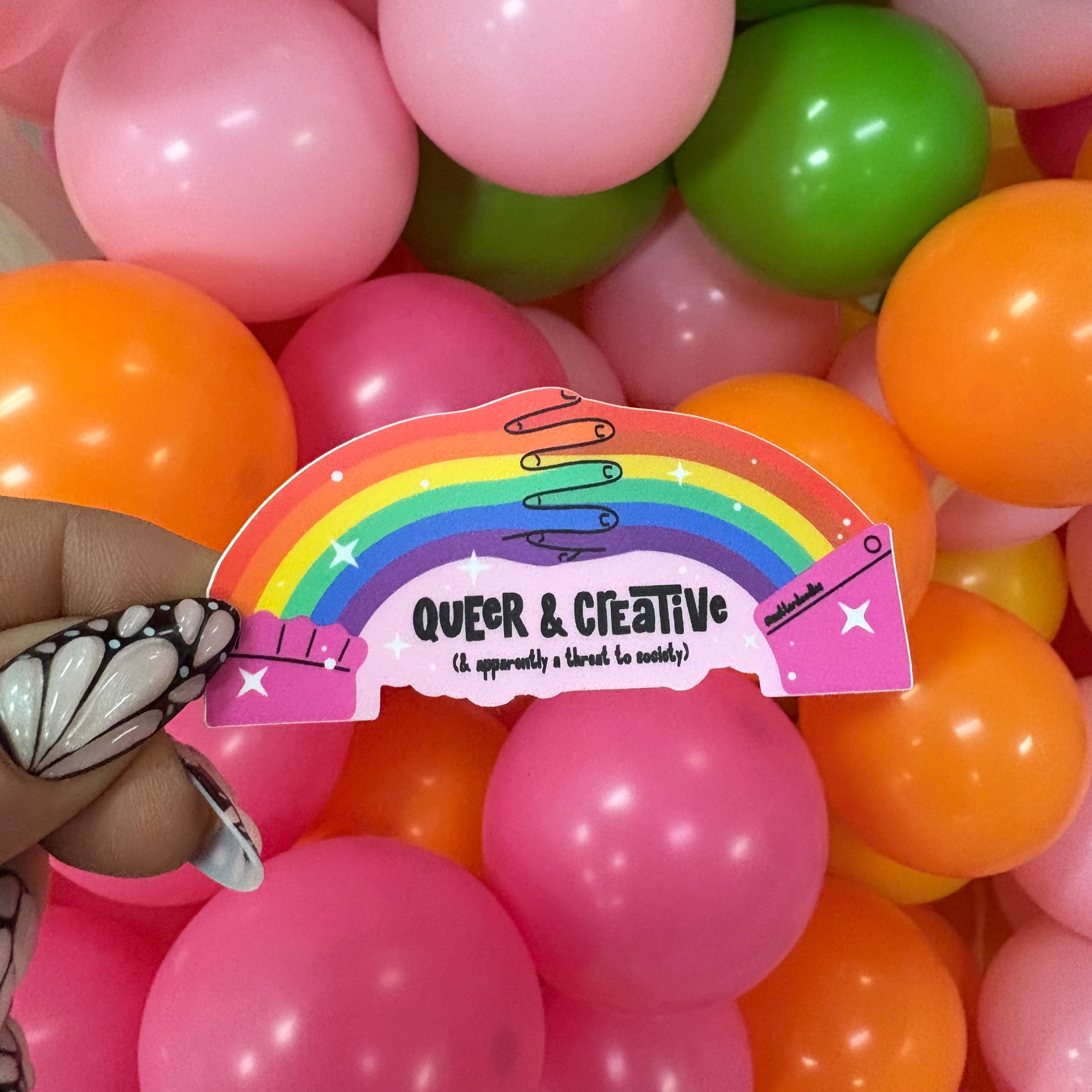 Queer and Creative and Apparently a Threat to Society Sticker