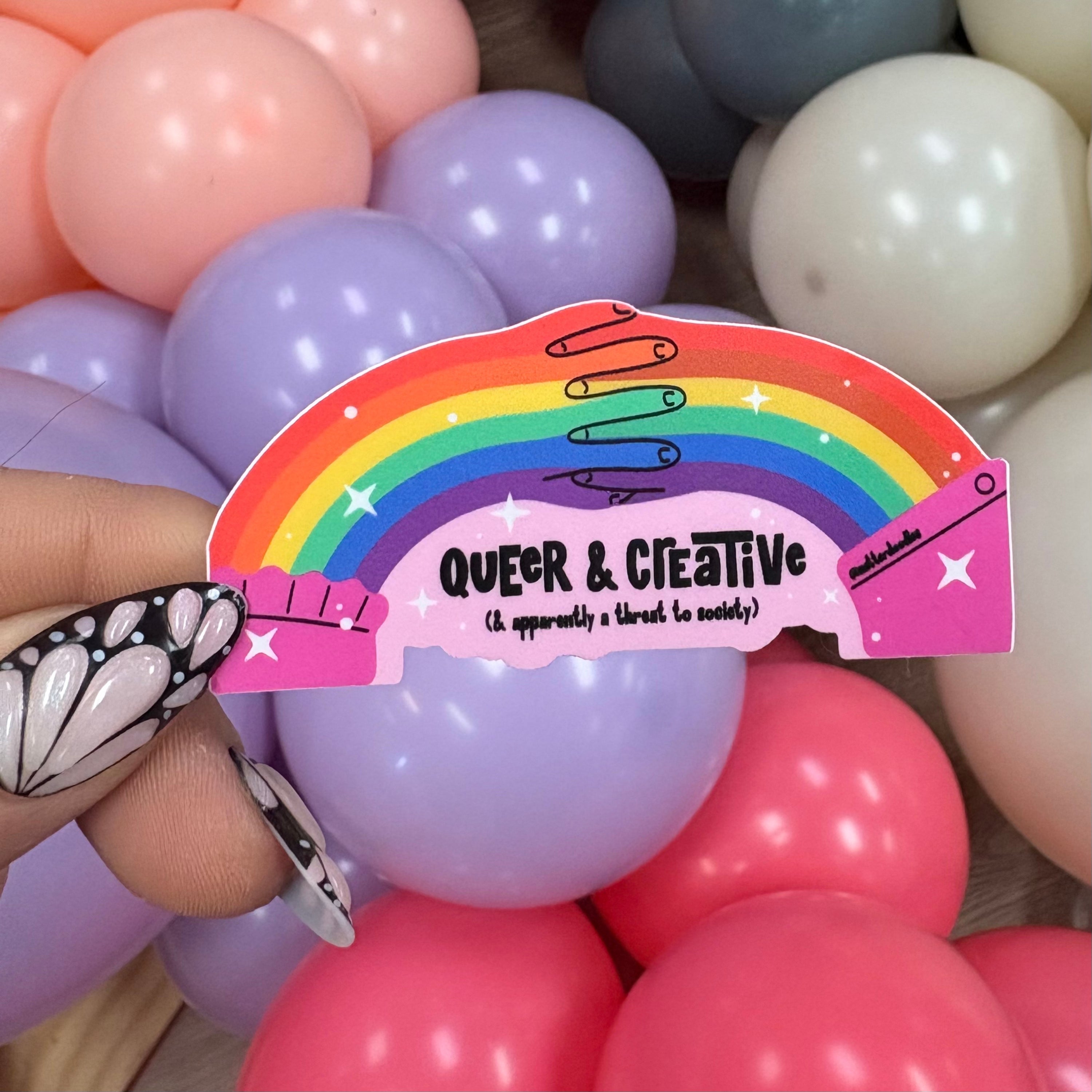 Queer and Creative and Apparently a Threat to Society Sticker