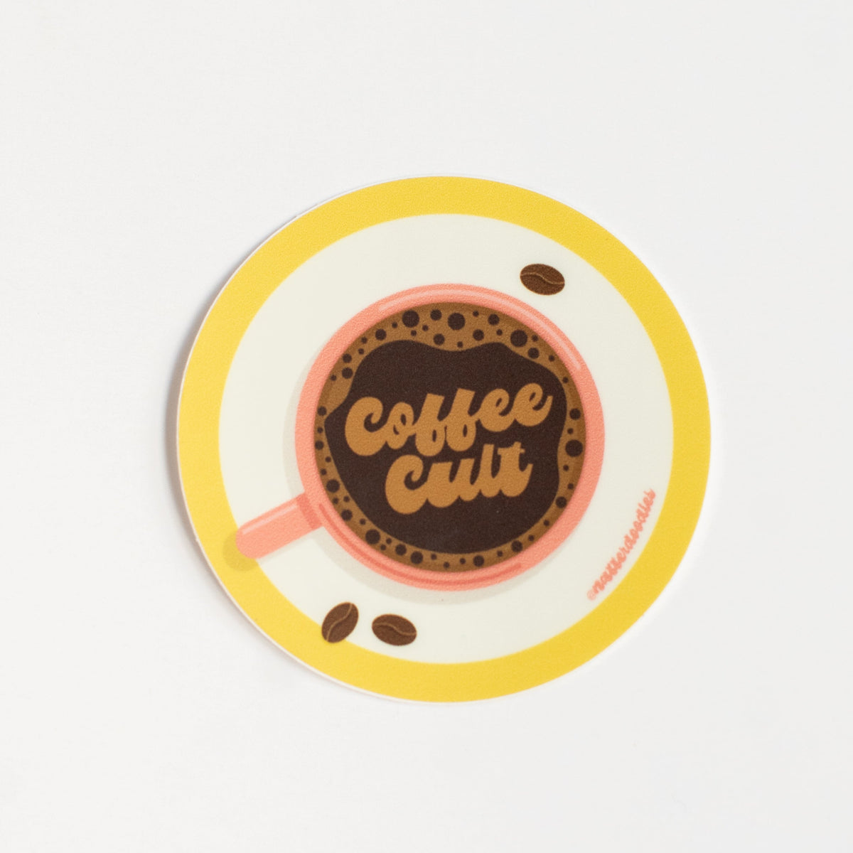Coffee Cult vinyl sticker with a retro pink coffee cup and saucer in warm yellow, cream and brown details