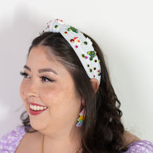 Woman wearing a colorful headband with a white background