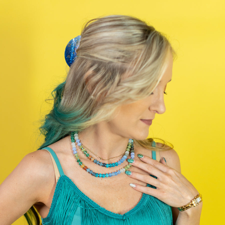 Multicolored beaded necklace on a white background