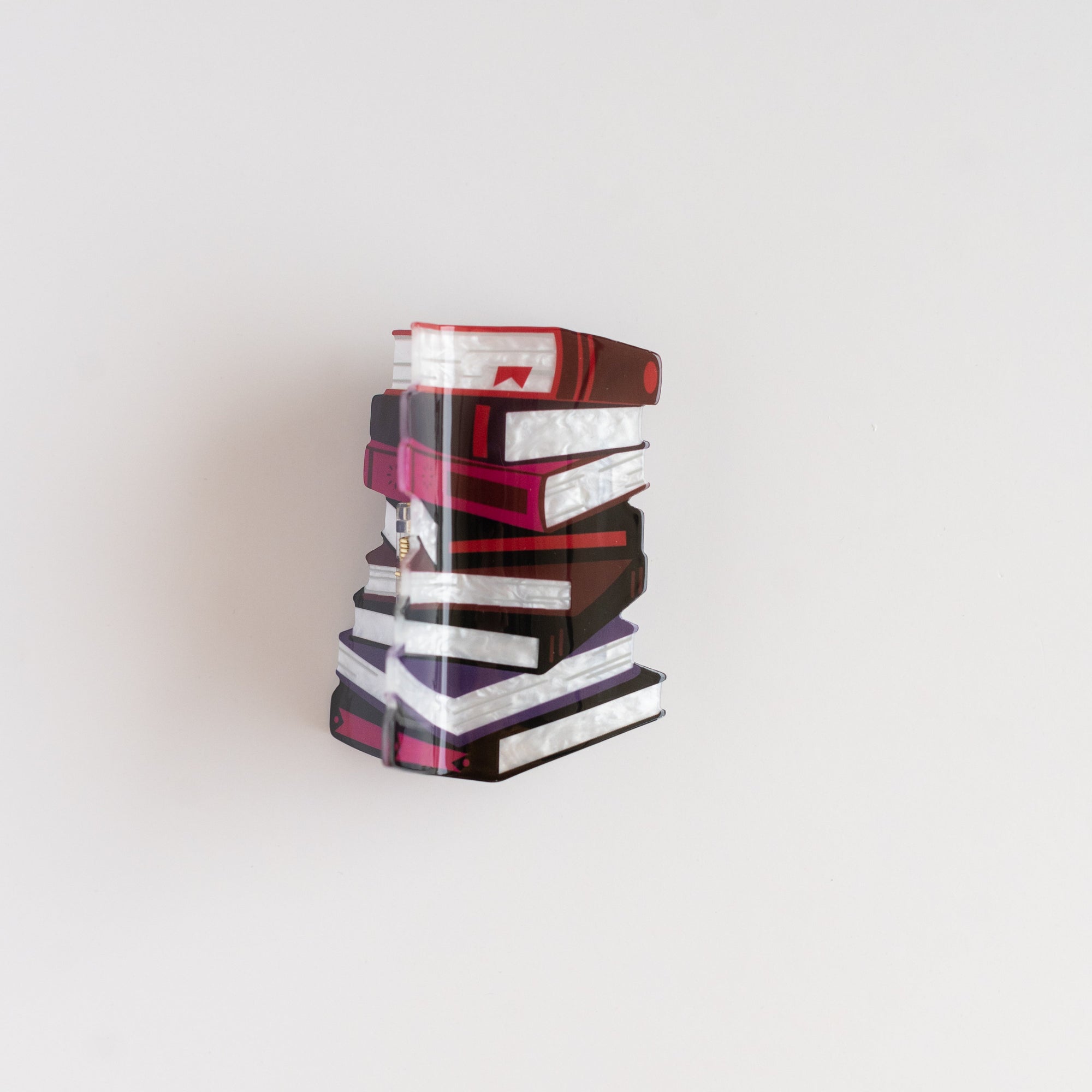 Stack of books with colorful spines on a white background