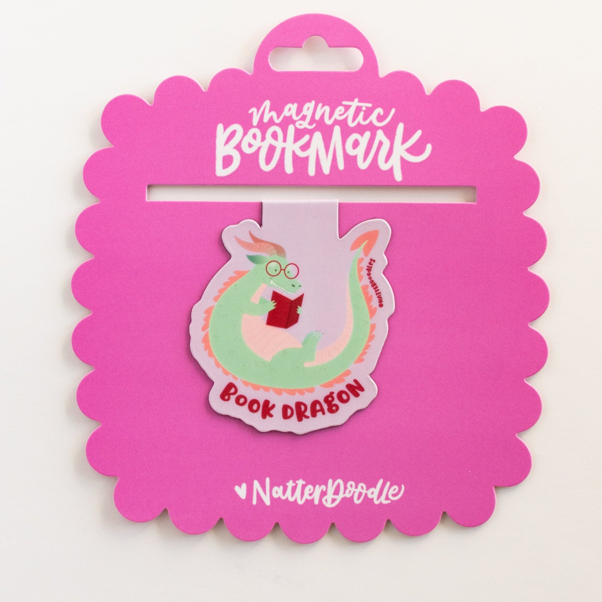 Magnetic bookmark with a pink packaging on a white background