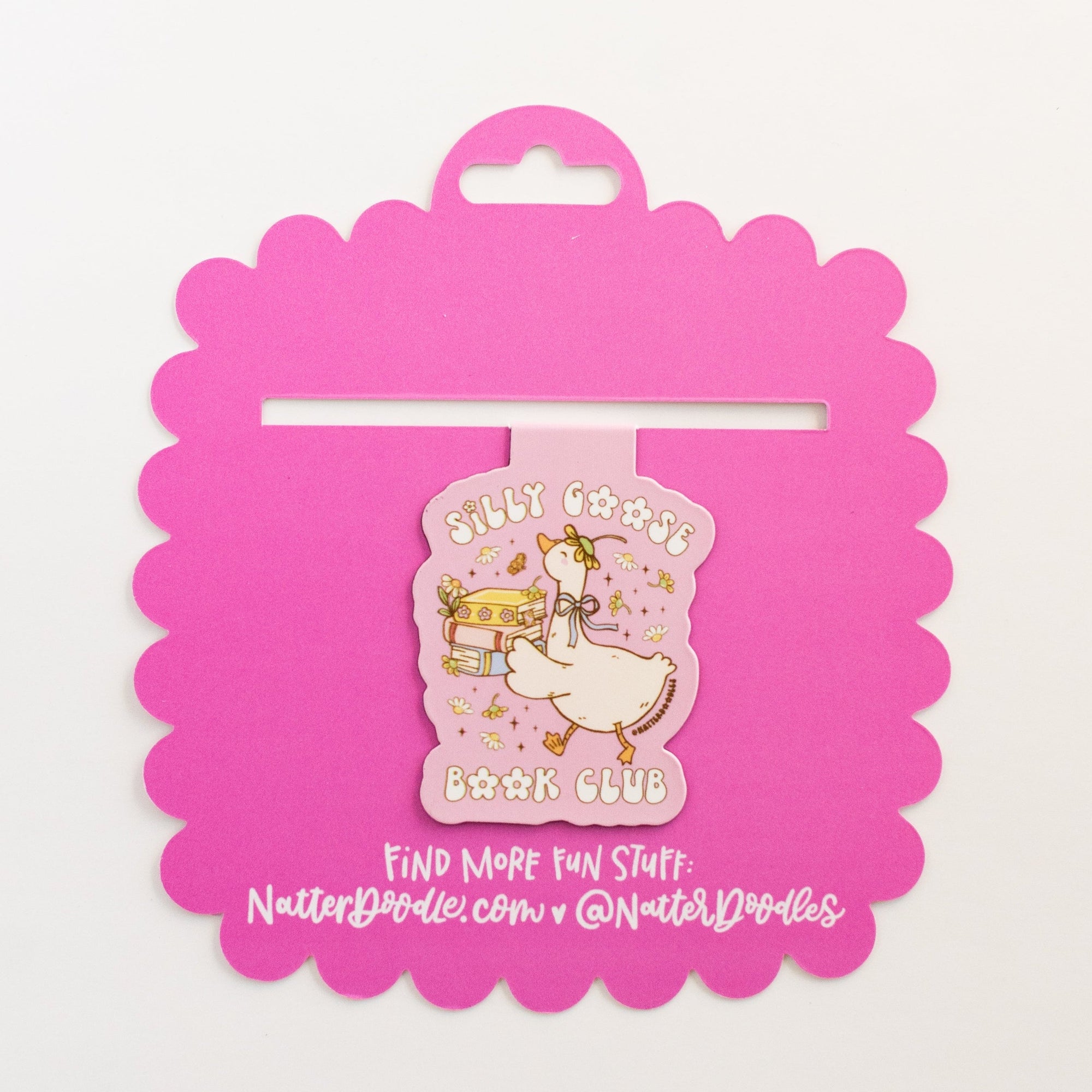 Pink packaging with a cartoon duck design on a white background