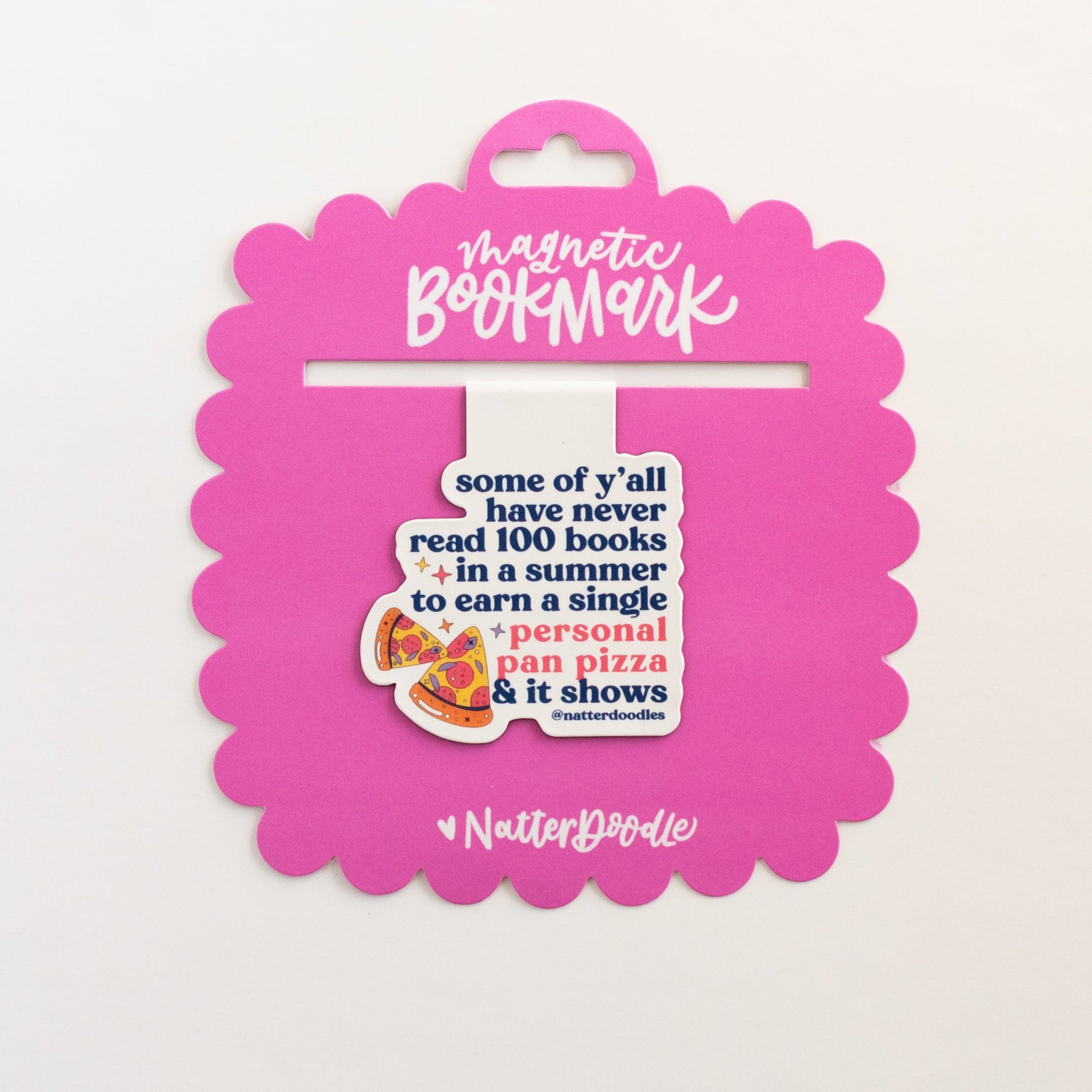 Pink bookmark packaging with text and a cartoon character on a white background