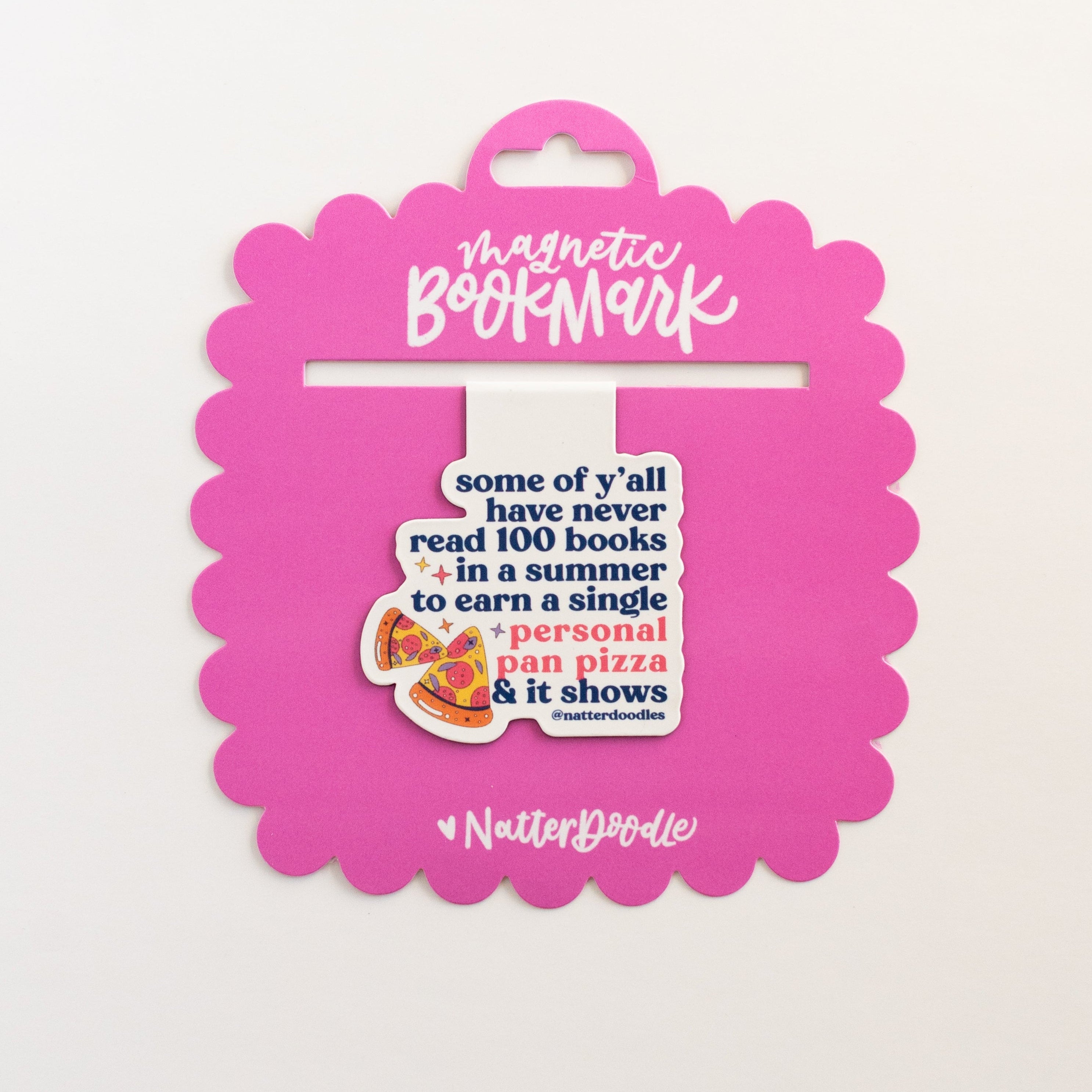 Pink bookmark packaging with text and a cartoon character on a white background