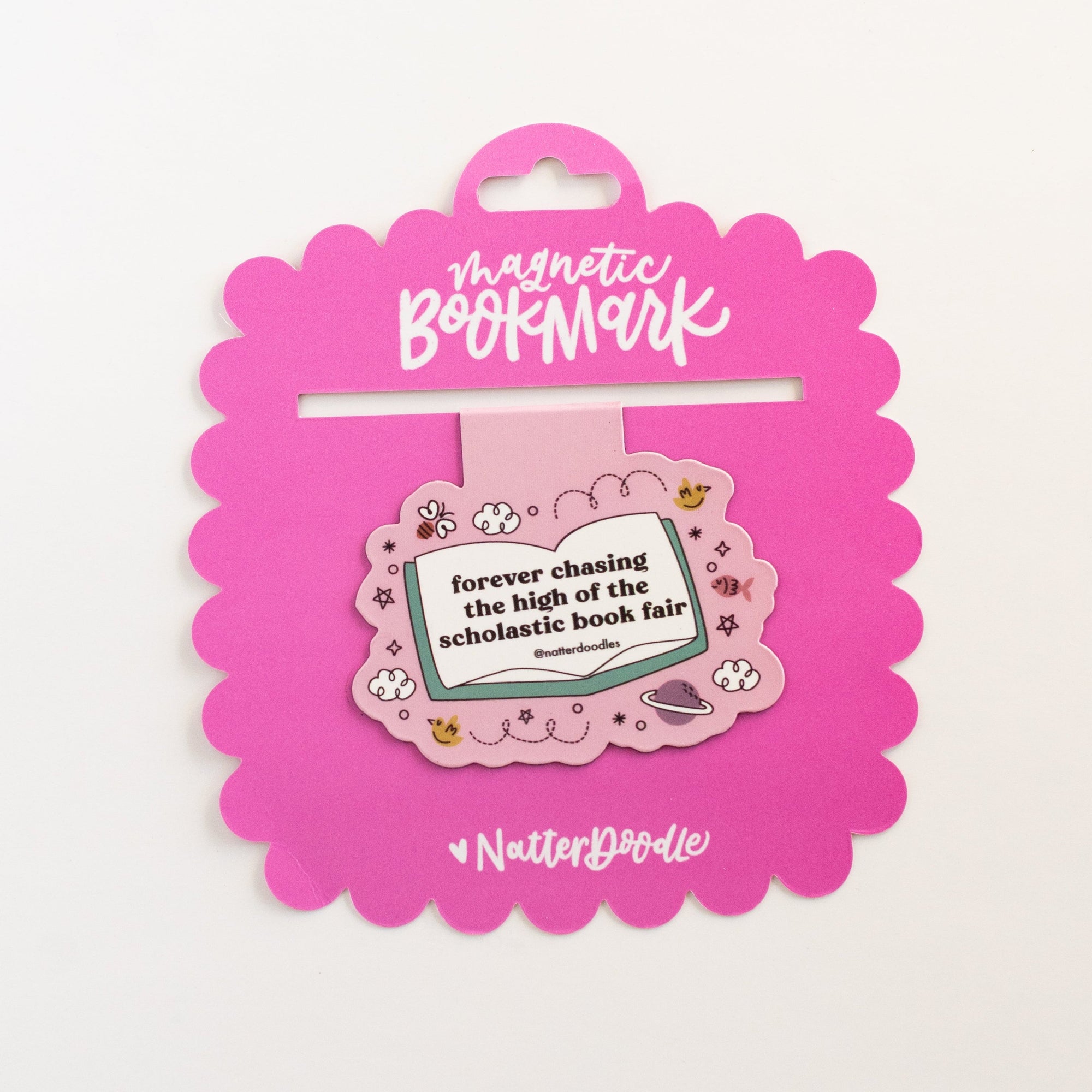 Pink magnetic bookmark on a white background