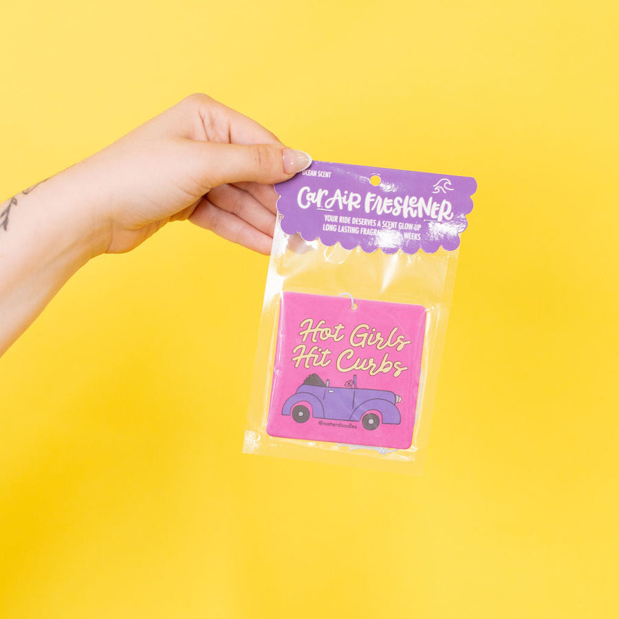 air freshener that says hot girls hit curbs
