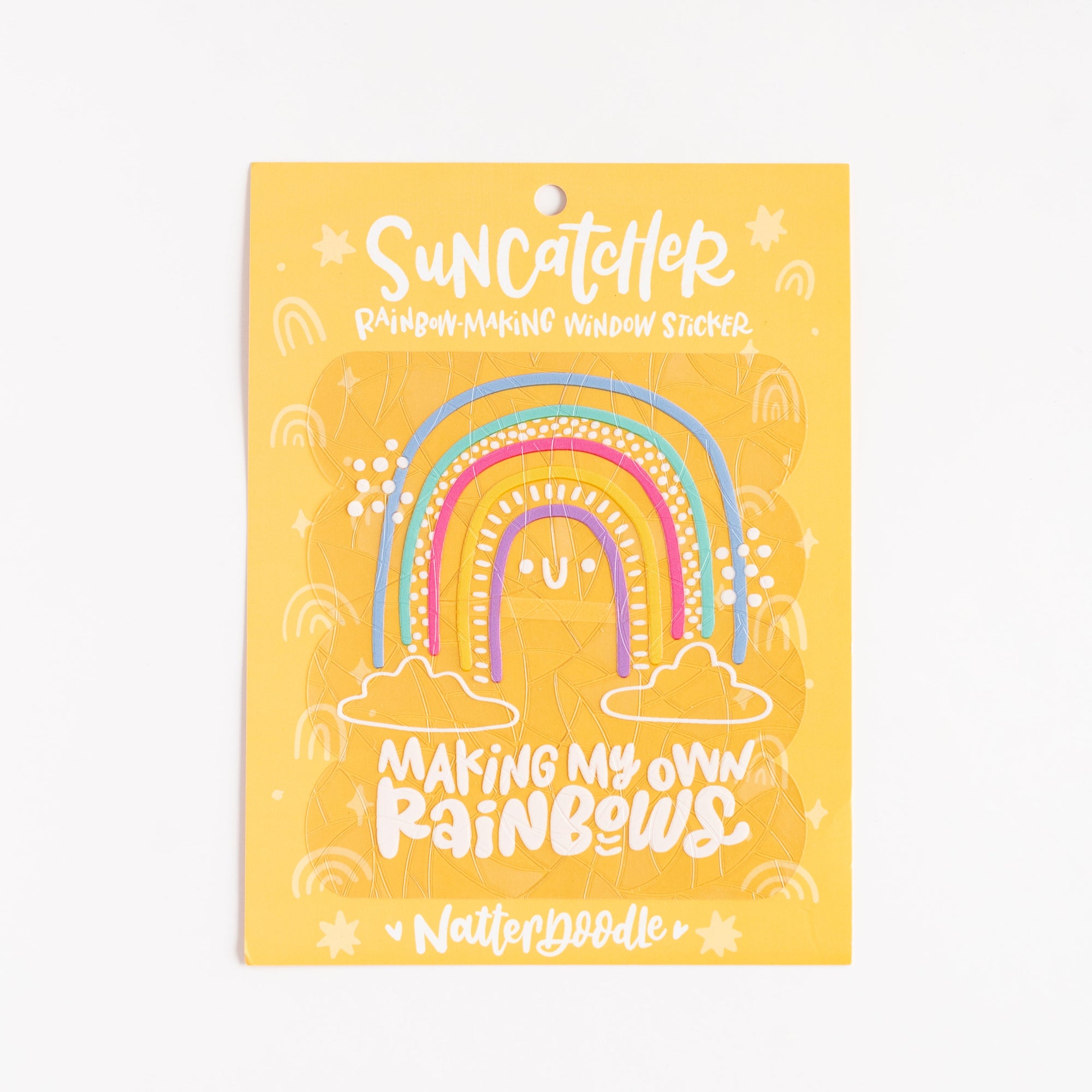 Yellow craft kit packaging with rainbow design and text on a white background