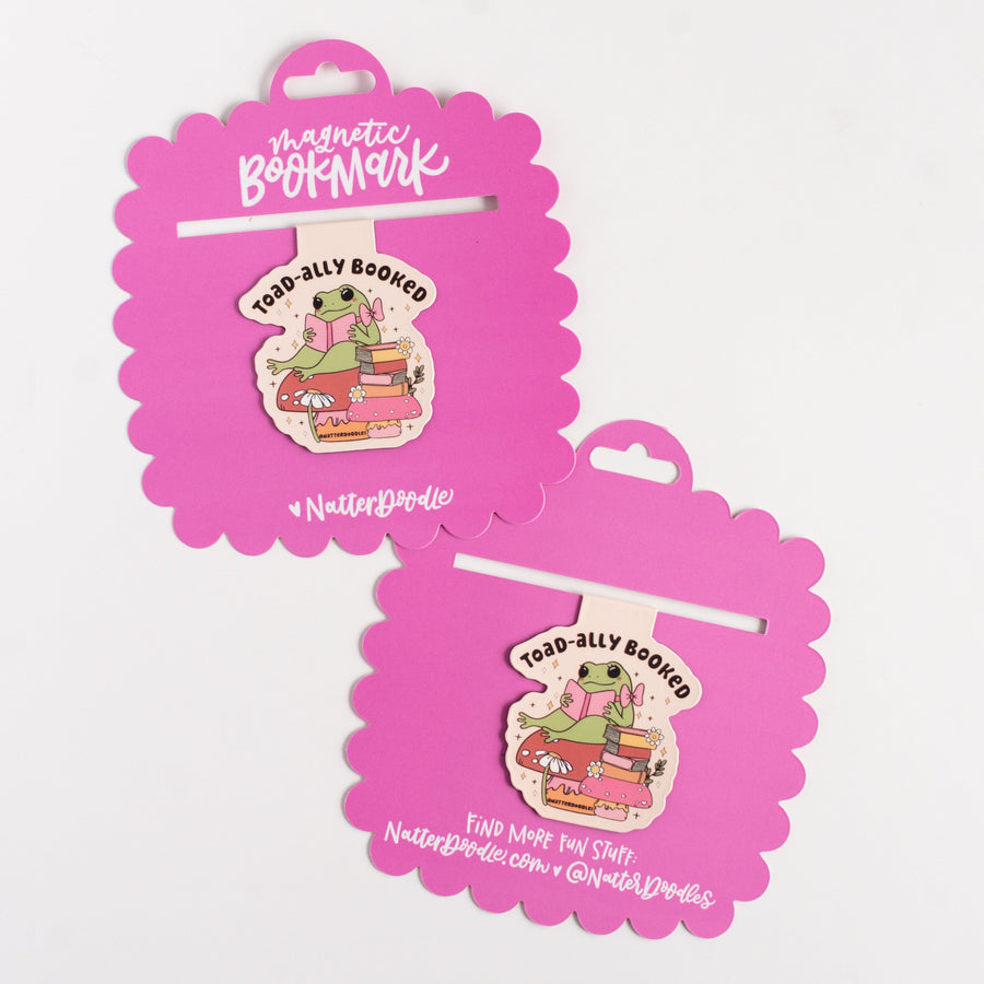 Pink magnetic bookmark with a cartoon character on a white background