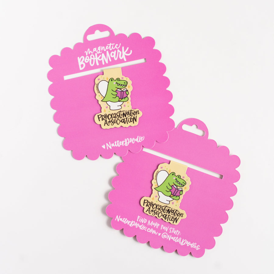 Pink packaging of a magnetic bookmark with a cartoon character on a white background