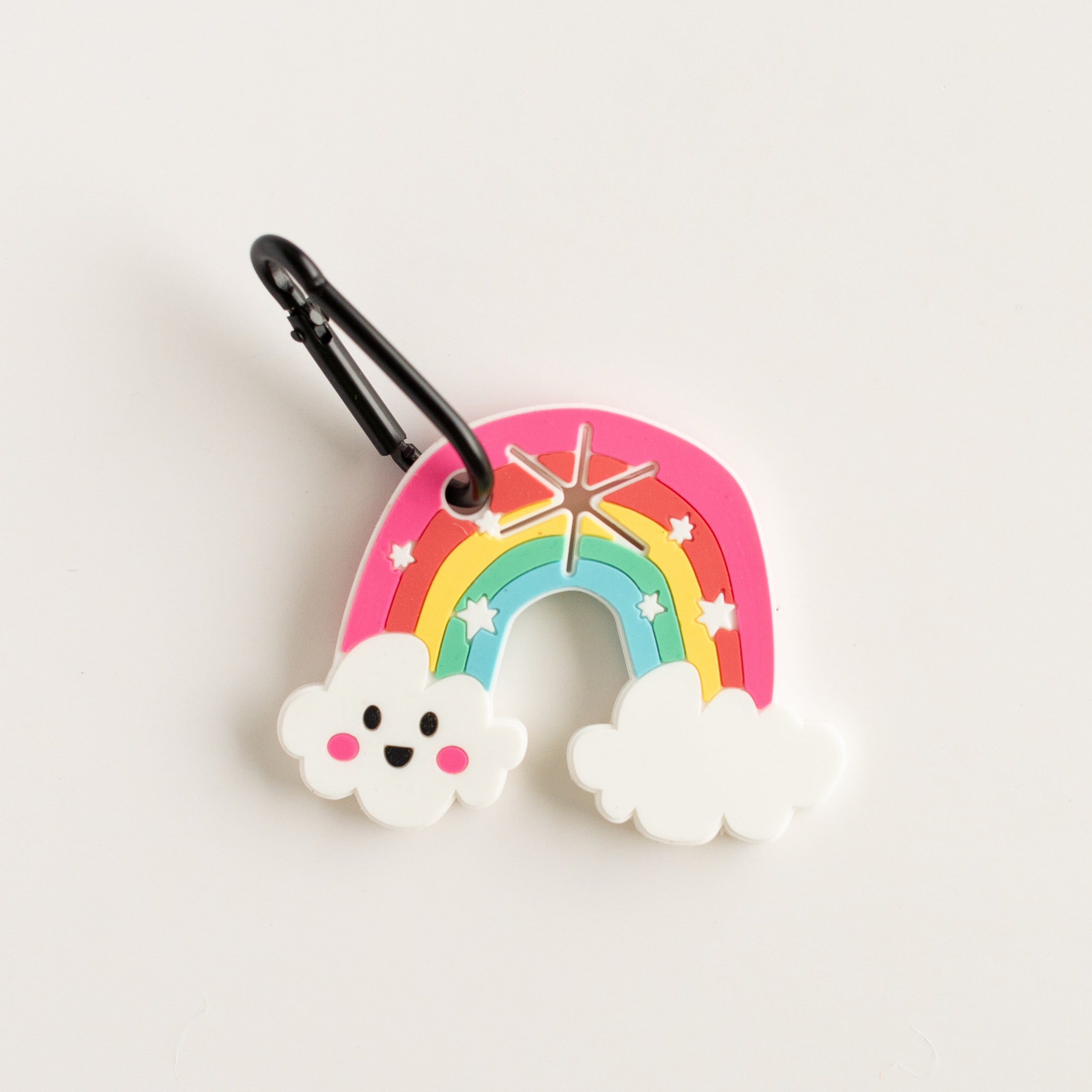 Colorful rainbow poo pal with cloud designs on a light gray background