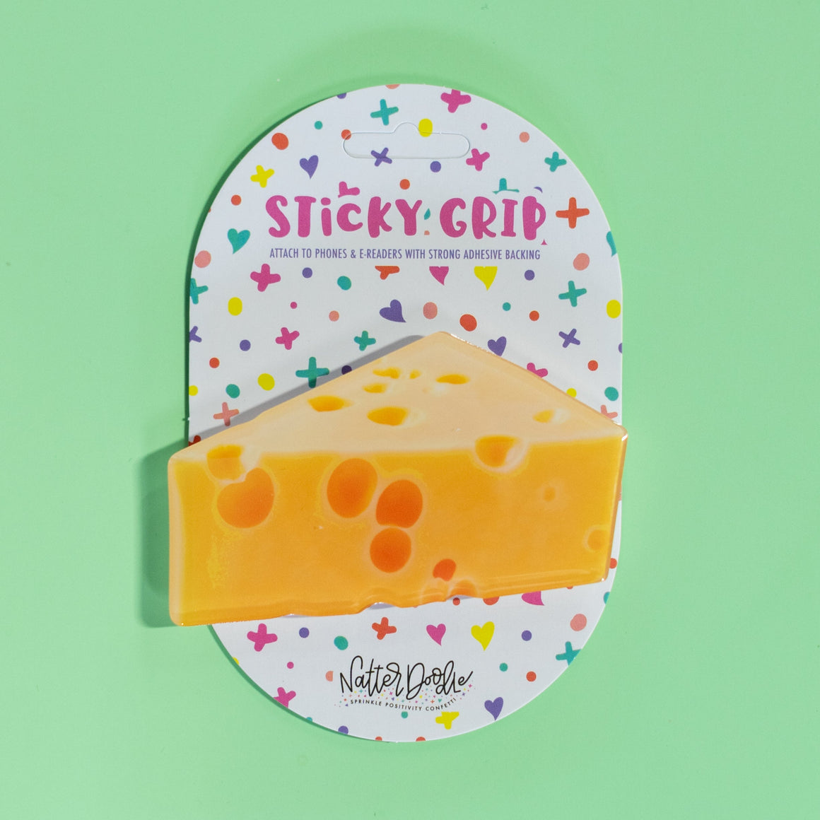  Sticky grip pad with cheese design on a green background