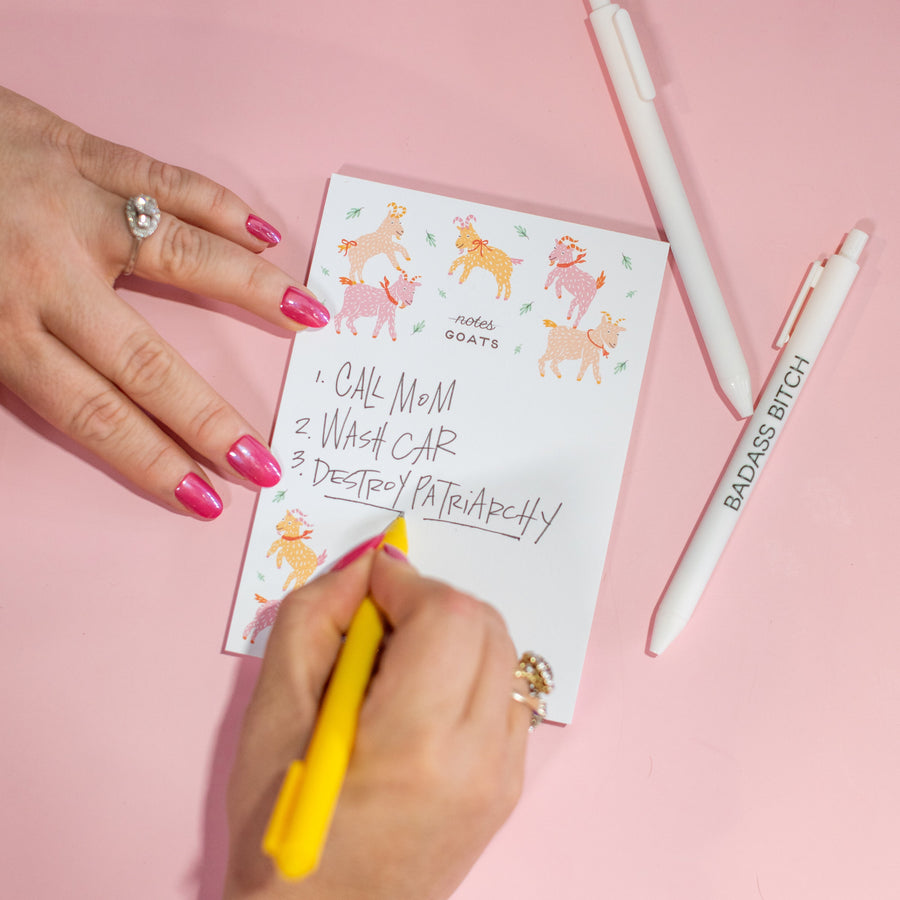 Notepad with cartoon goats on a white background