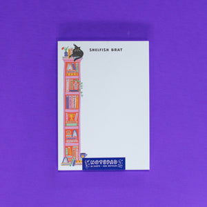 Notepad with colorful illustrations on a purple background
