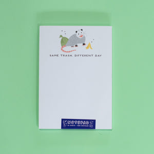 Notepad with a cartoon character on a green background