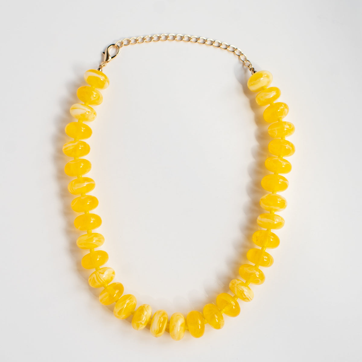 Main Squeeze acrylic beaded necklace by NatterDoodle, front view on a white background