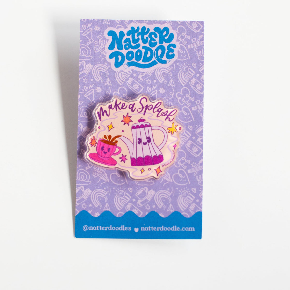 Make a Splash acrylic pin with a smiling coffee pot pouring into a pink cup, on a NatterDoodle backing card