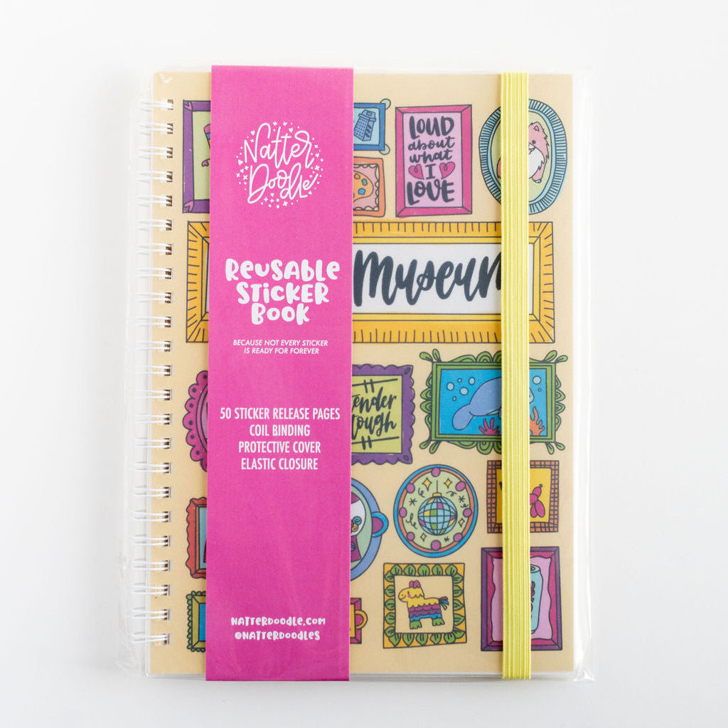 Reusable sticker book with colorful designs and a pink band on a white background