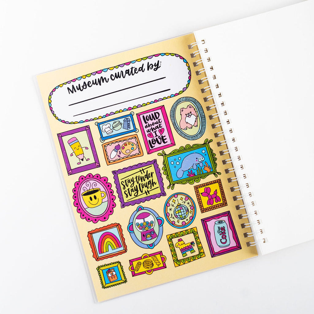Sheet of colorful stickers with various designs on a spiral-bound notebook.