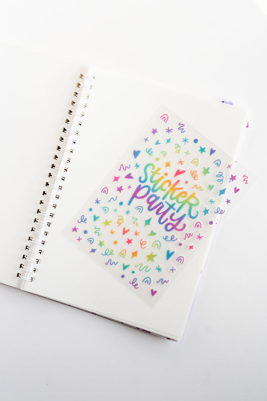 Notebook with 'Sticker Party' design on a white background