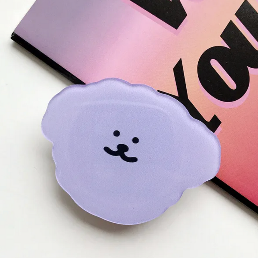 Purple sticky grip with colorful design on a green background