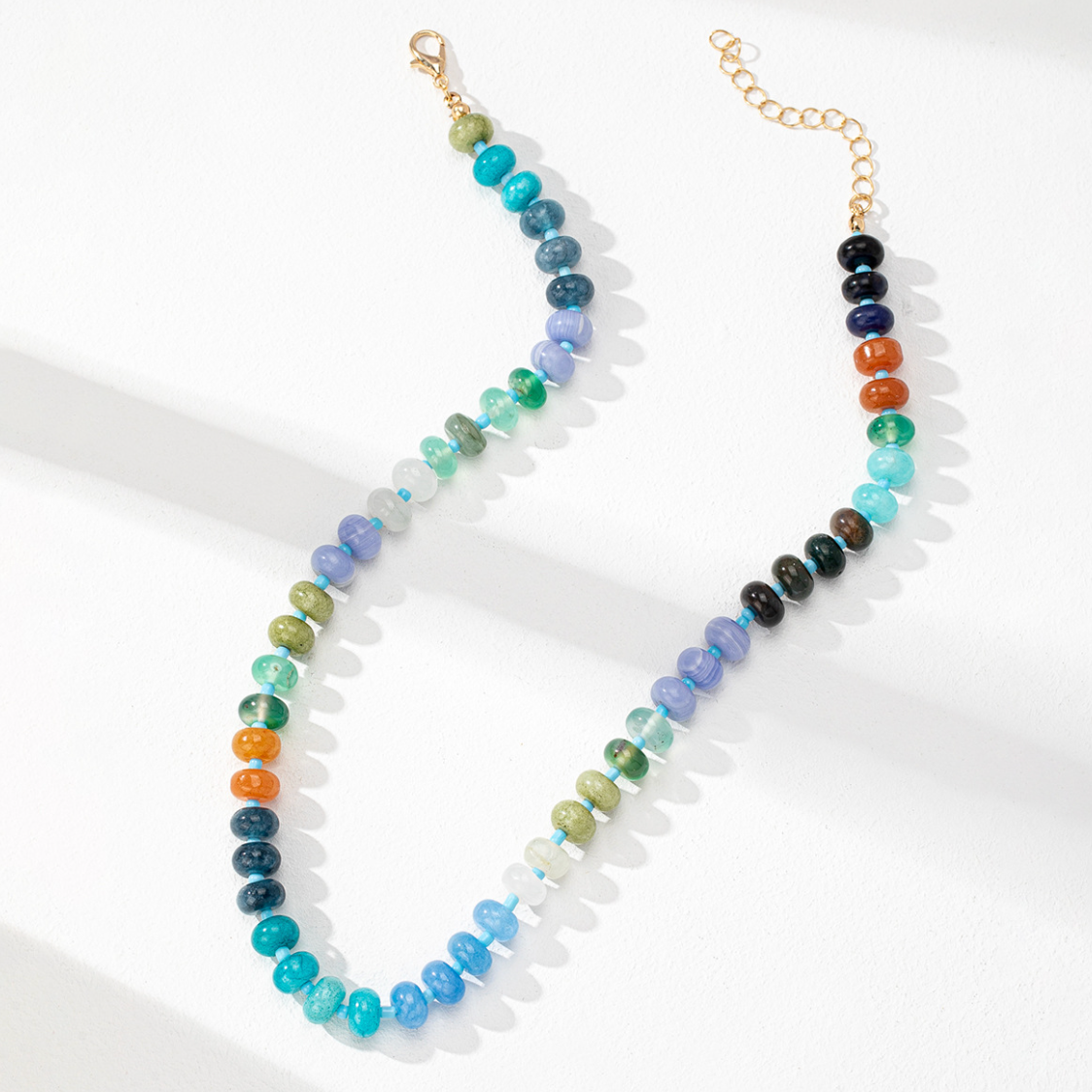 Multicolored beaded necklace on a white background