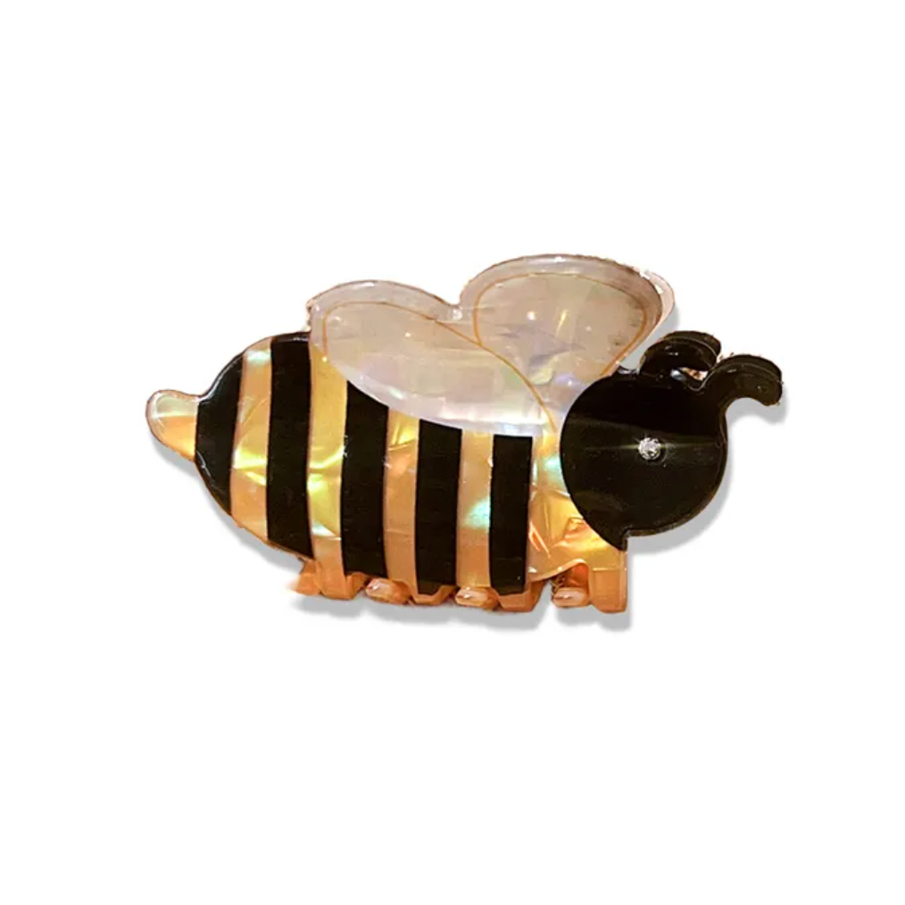 Glass bee figurine with black and yellow stripes on a white background