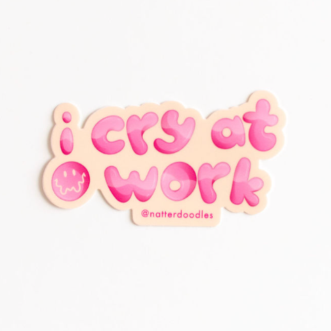 Sticker with 'i cry at work' text on a light pink background