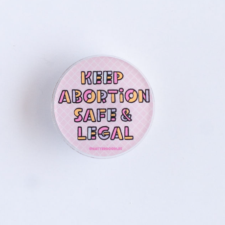 Button with 'Keep Abortion Safe & Legal' text on a light purple background