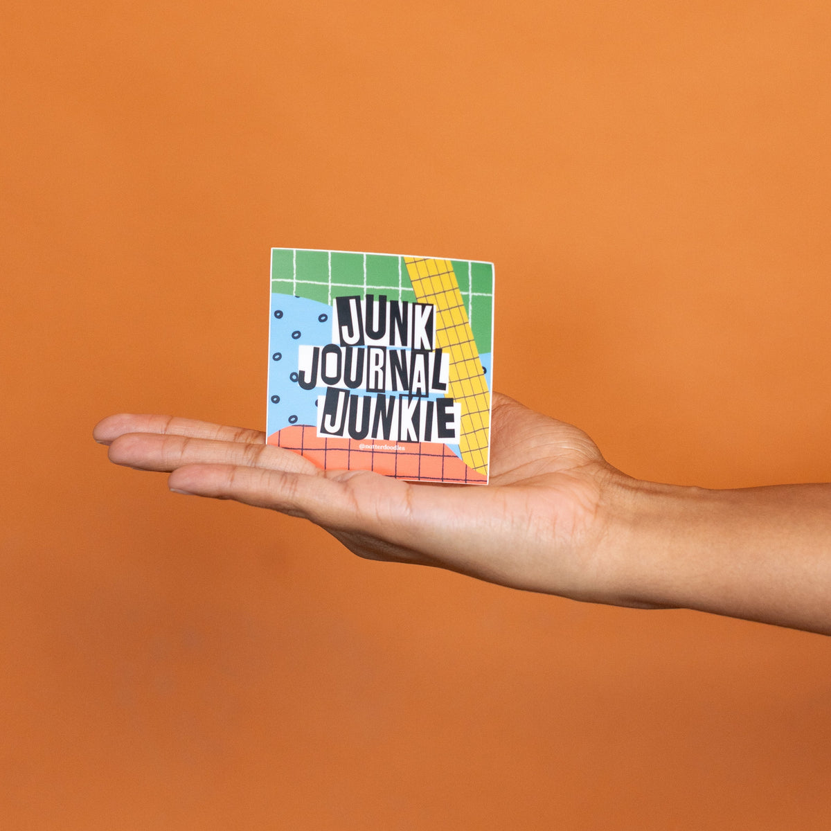 Square 3 inch Junk Journal Junkie sticker on a white background, front view