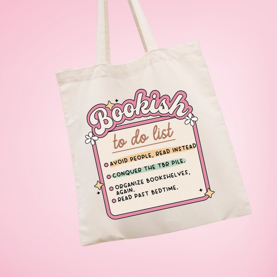 Tote bag with 'Bookish to do list' design held by a hand against a neutral background