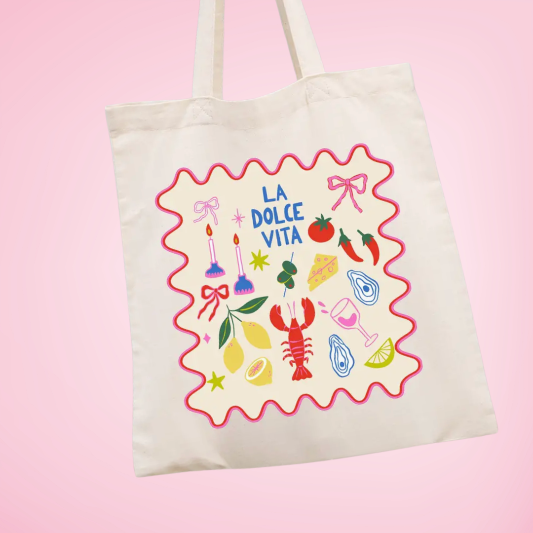 Tote bag with 'La Dolce Vita' design on a pink background