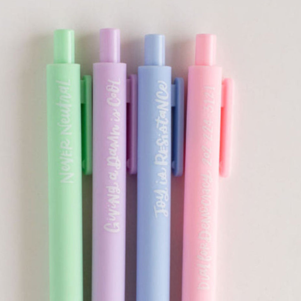 Set of pastel-colored pens on a light gray background