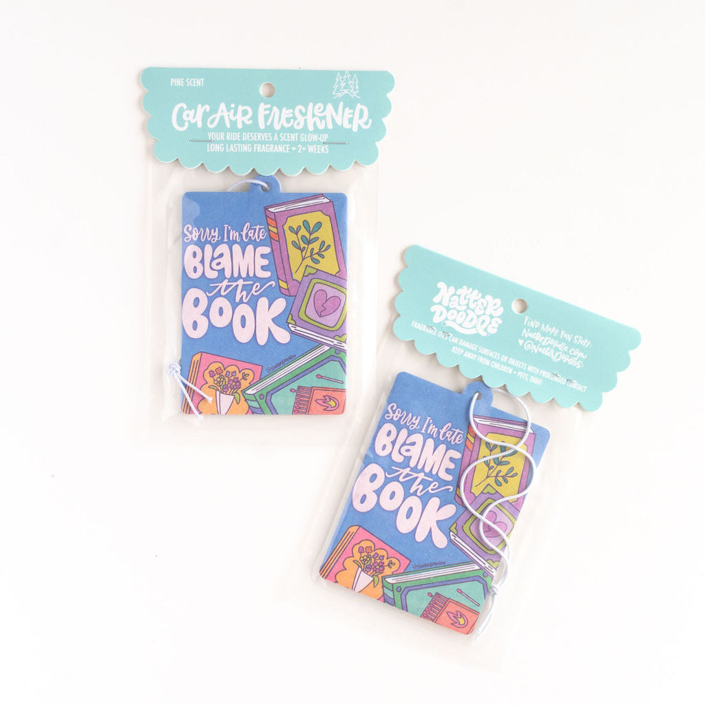 Two packages of 'Blame the Book' clear erasers on a white background