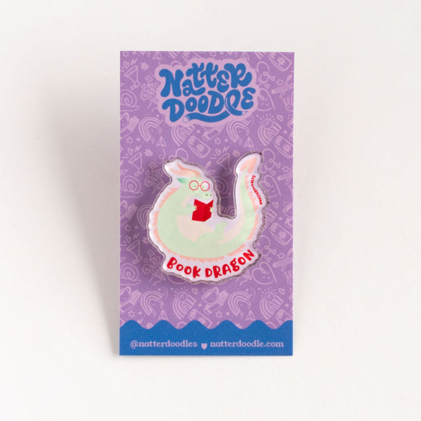 Purple packaging with a cartoon book dragon design on a white background