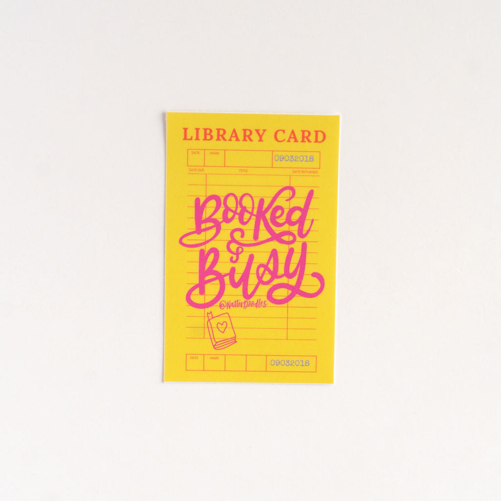 Yellow library card with pink text on a white background