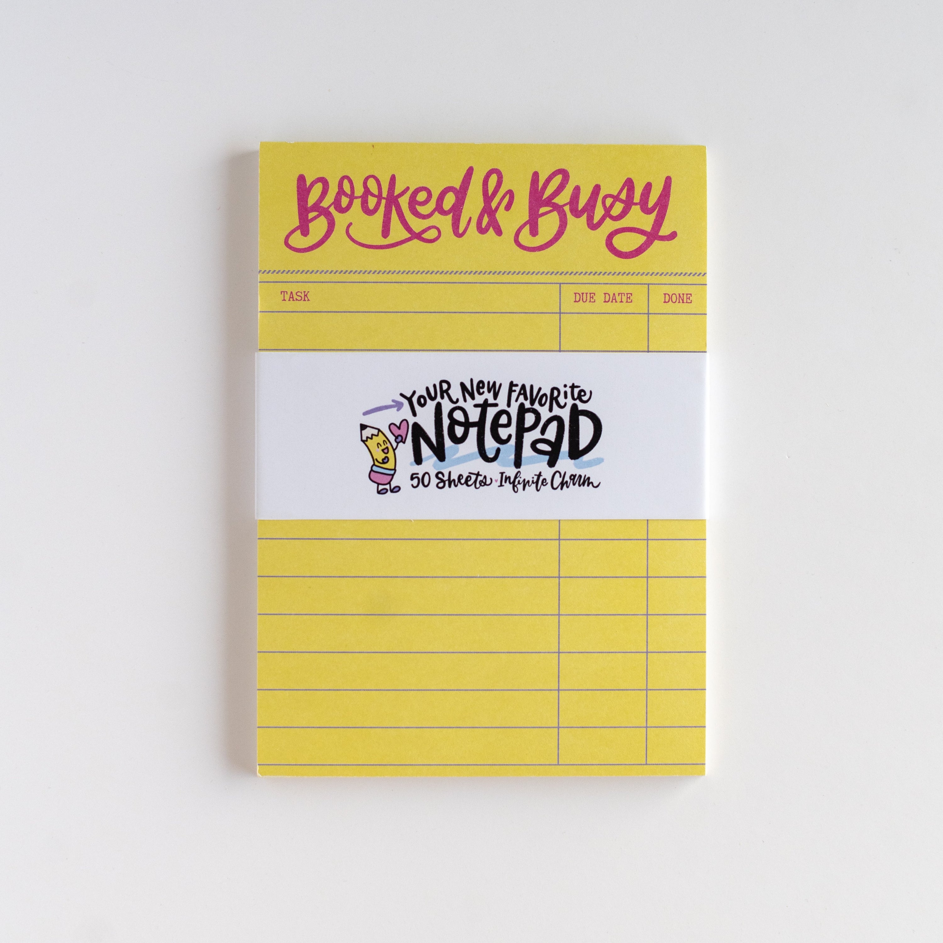 Yellow notepad with text on a white background