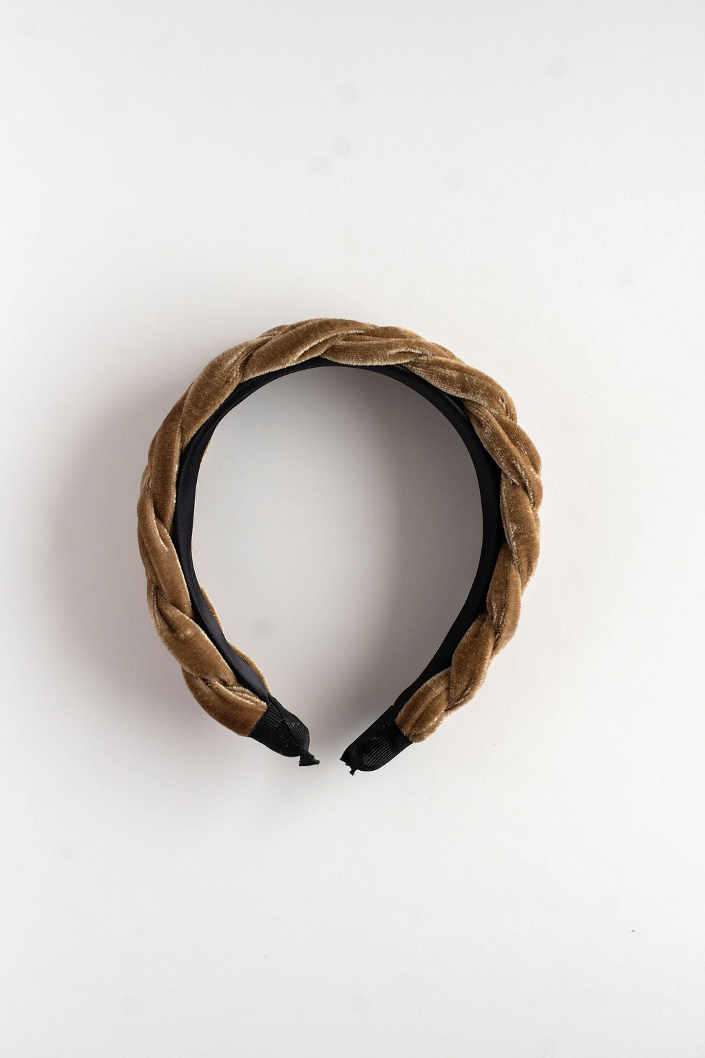 Brown velvet headband on a white background