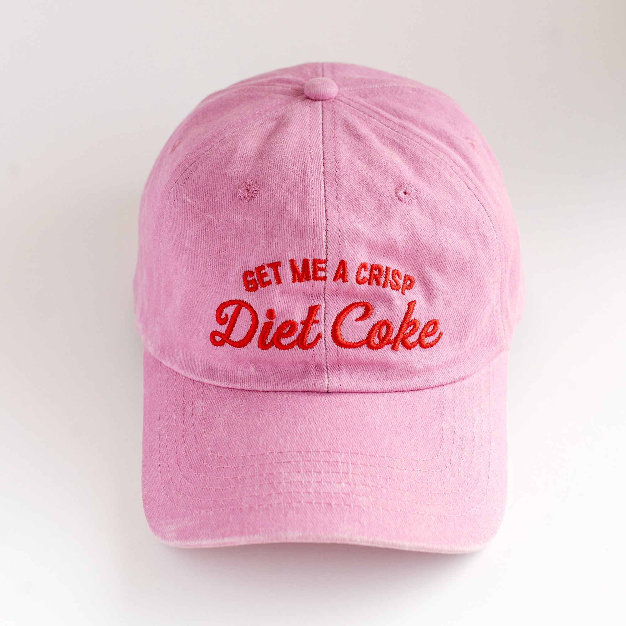 pink dad cap on white background