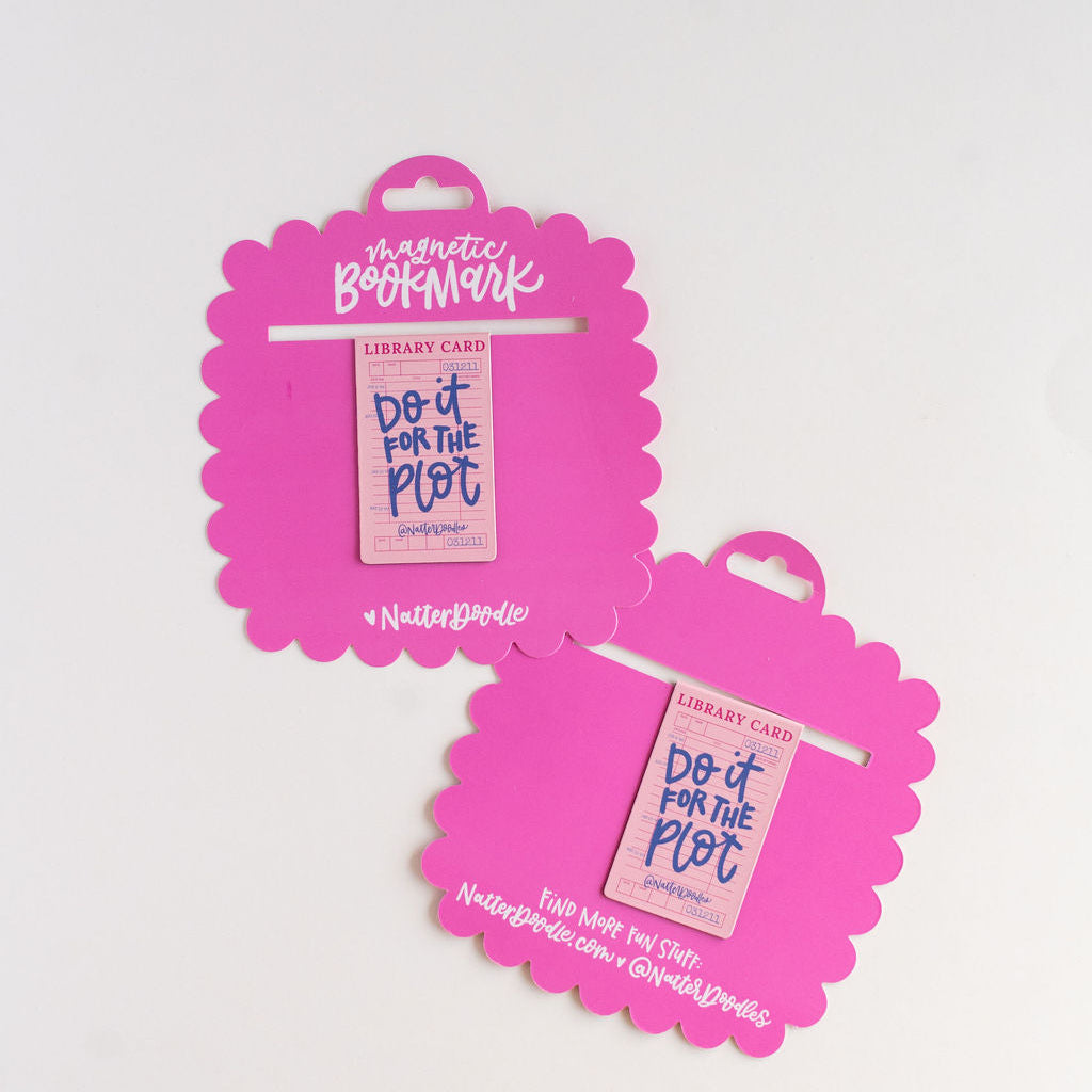 Two pink magnetic bookmarks with 'Do it for the Plot' text on a white background