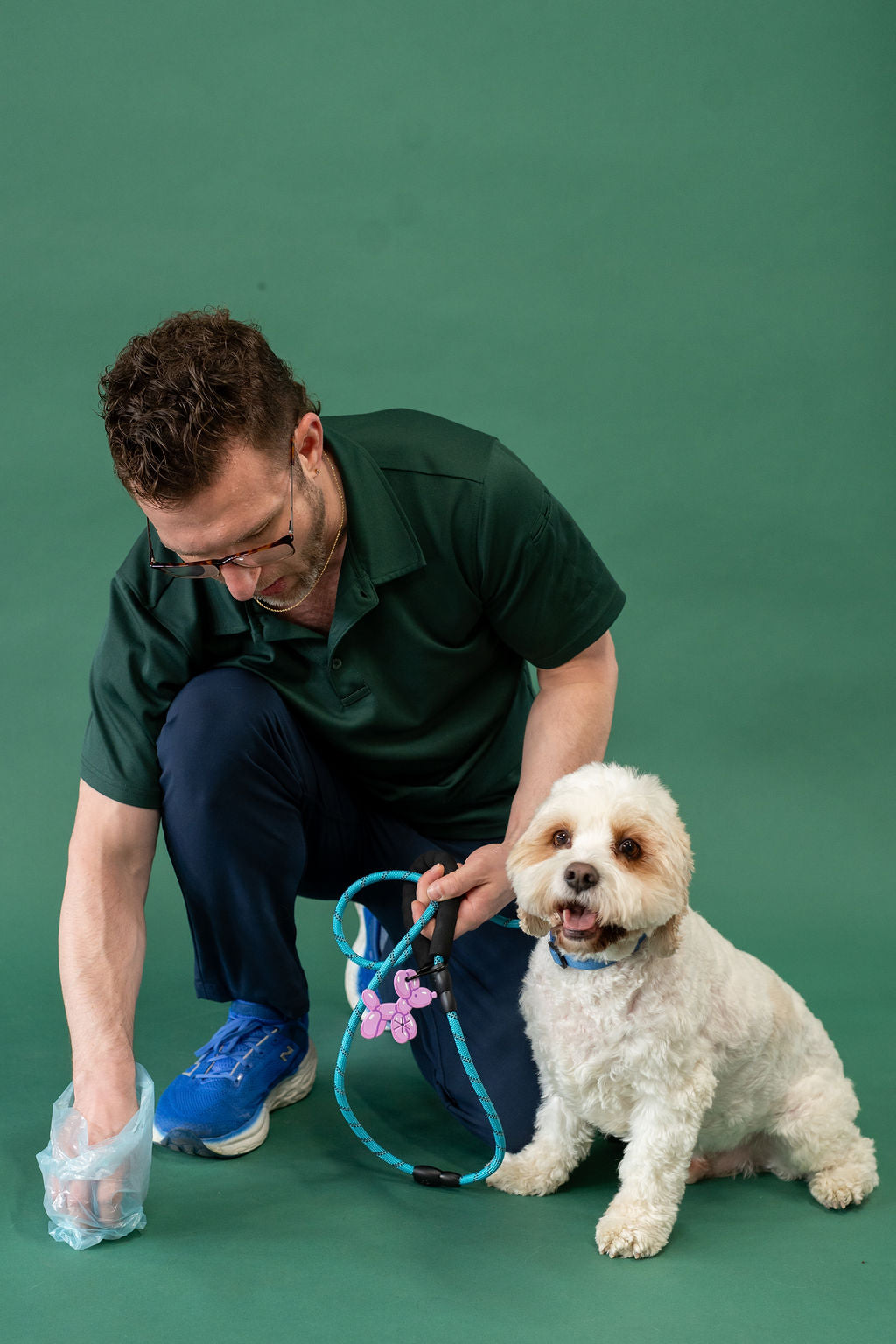 Man with a dog on a green background