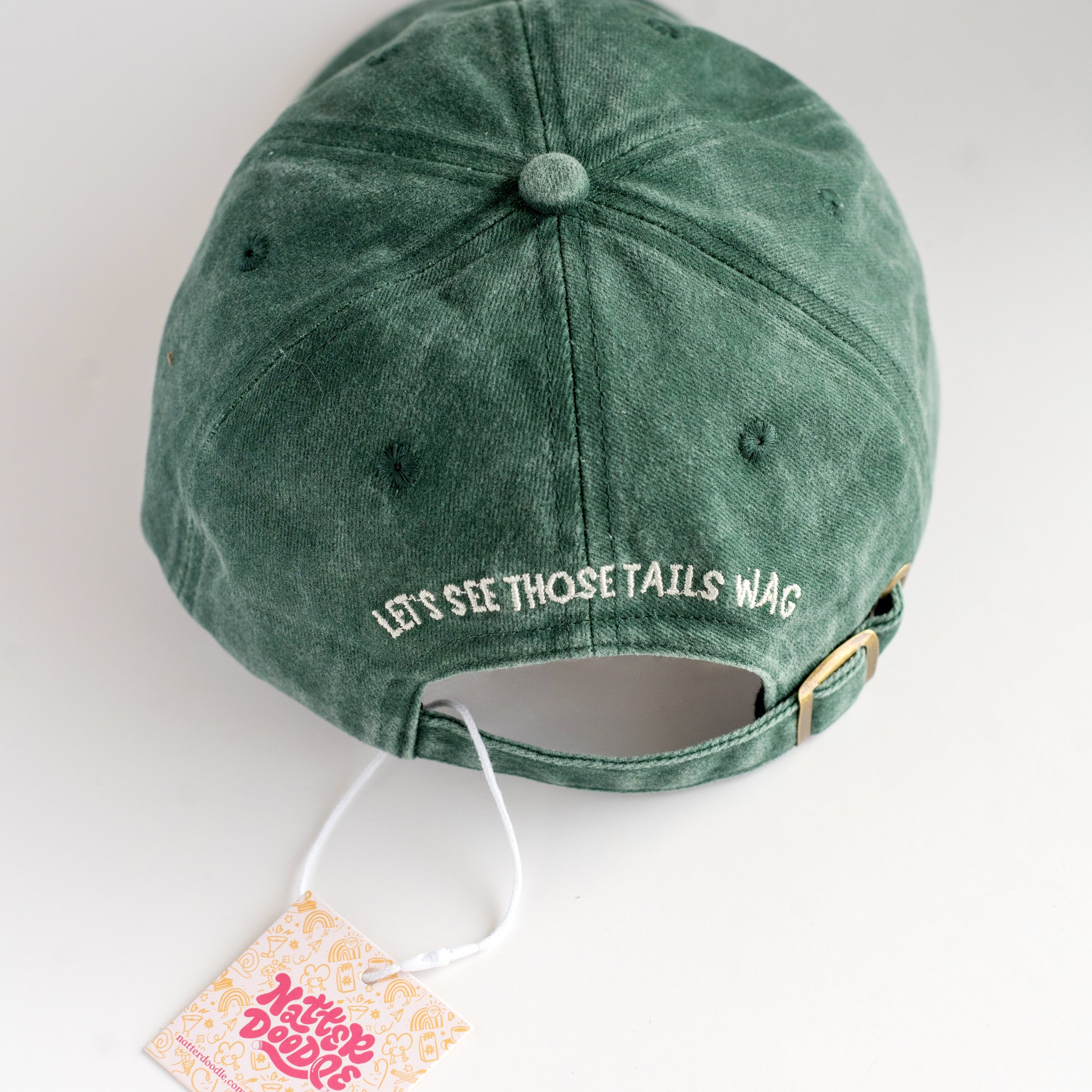 Green cap with text on a white background