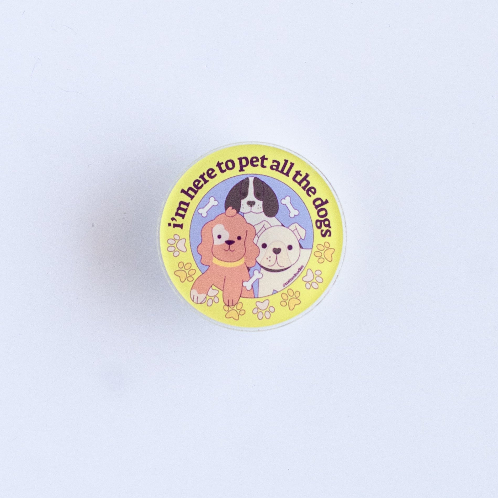 Round badge with cartoon characters on a light purple background