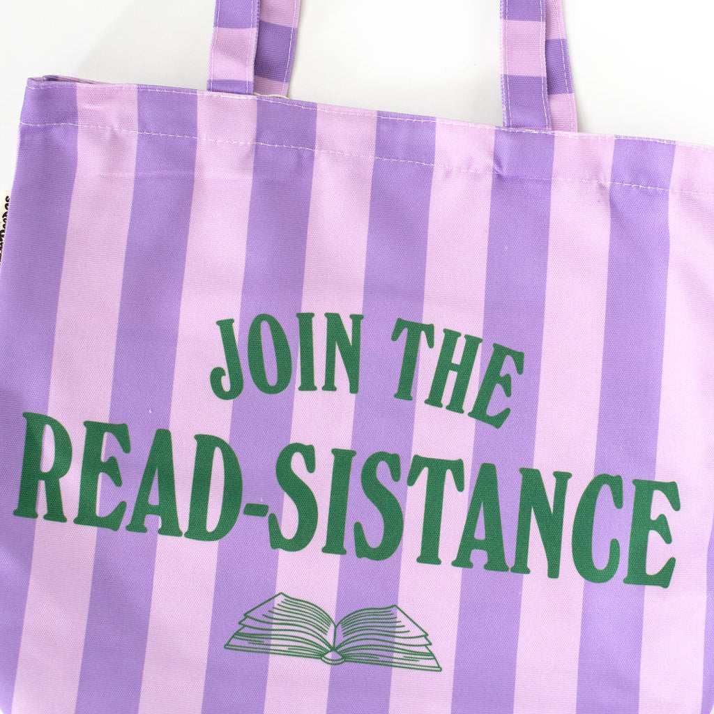 Striped tote bag with 'Join the Read-Sistance' text and book icon on a white background