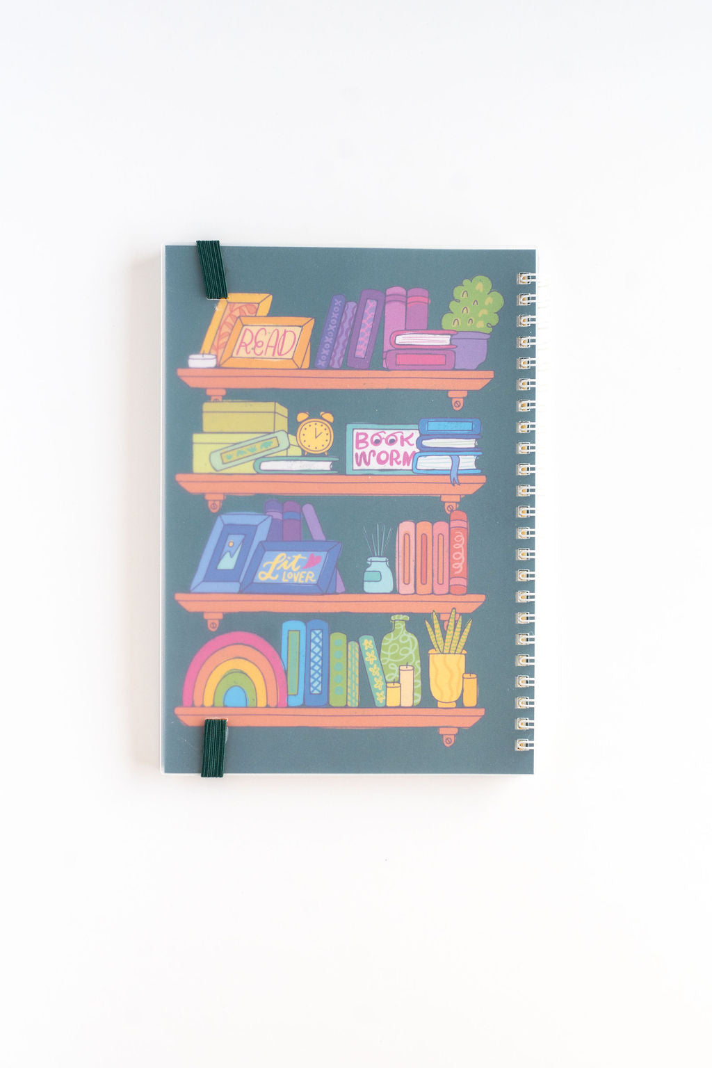 Notebook with colorful bookshelf illustration on a white background