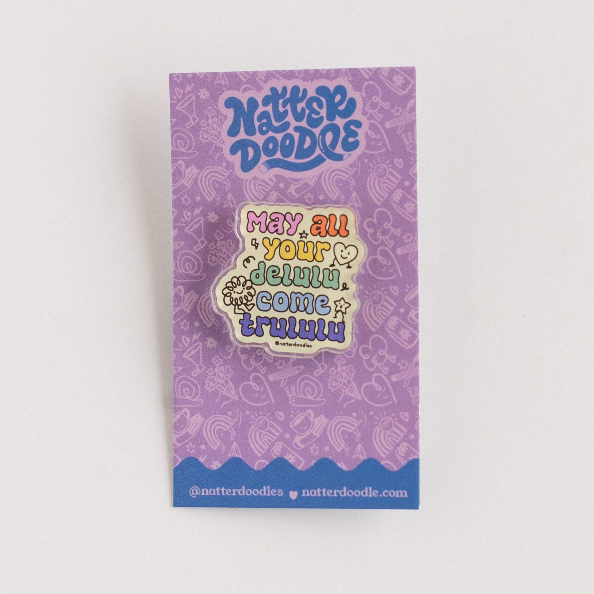 purple card backer with pin on it