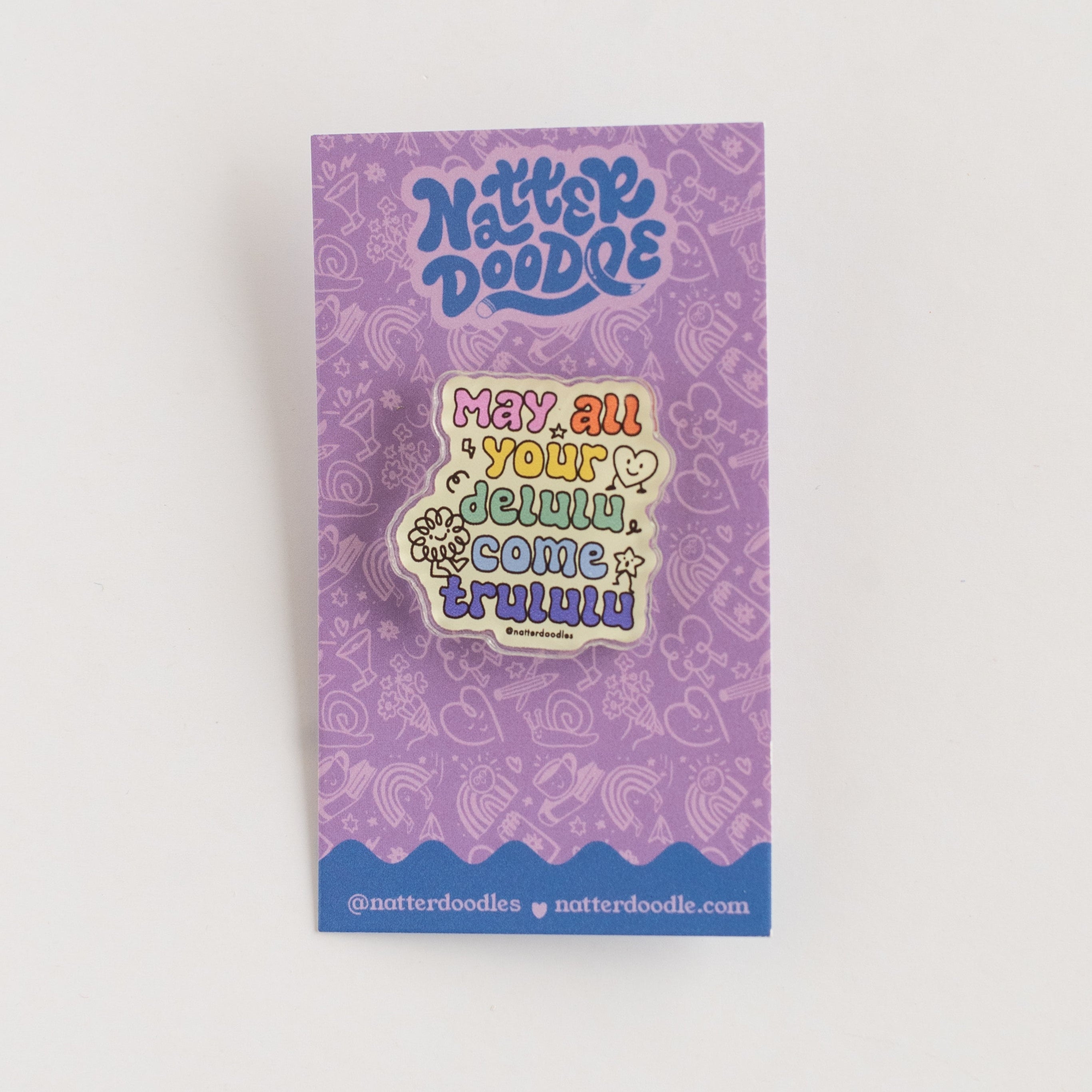 purple card backer with pin on it