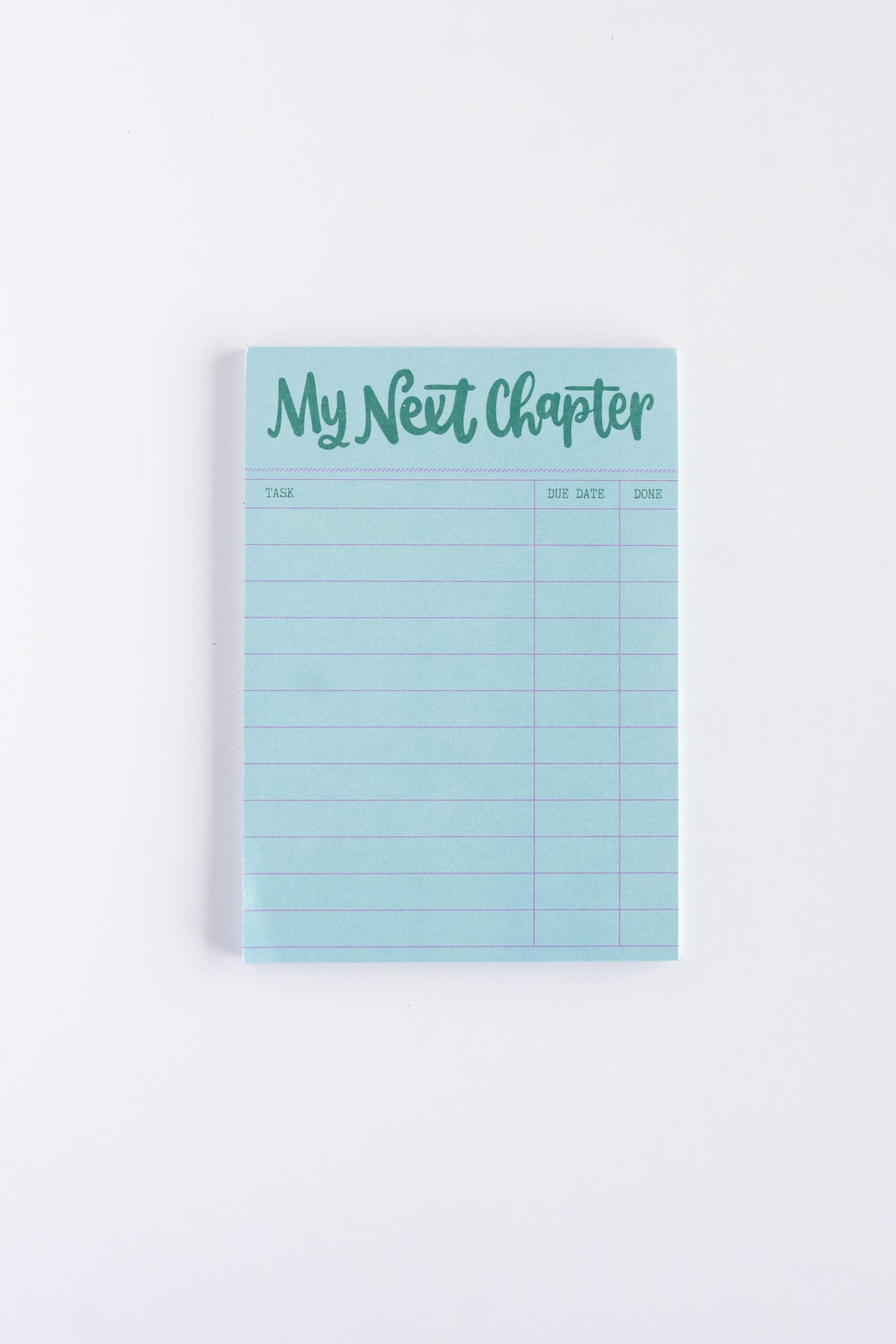 blue my next chapter notepad on white background