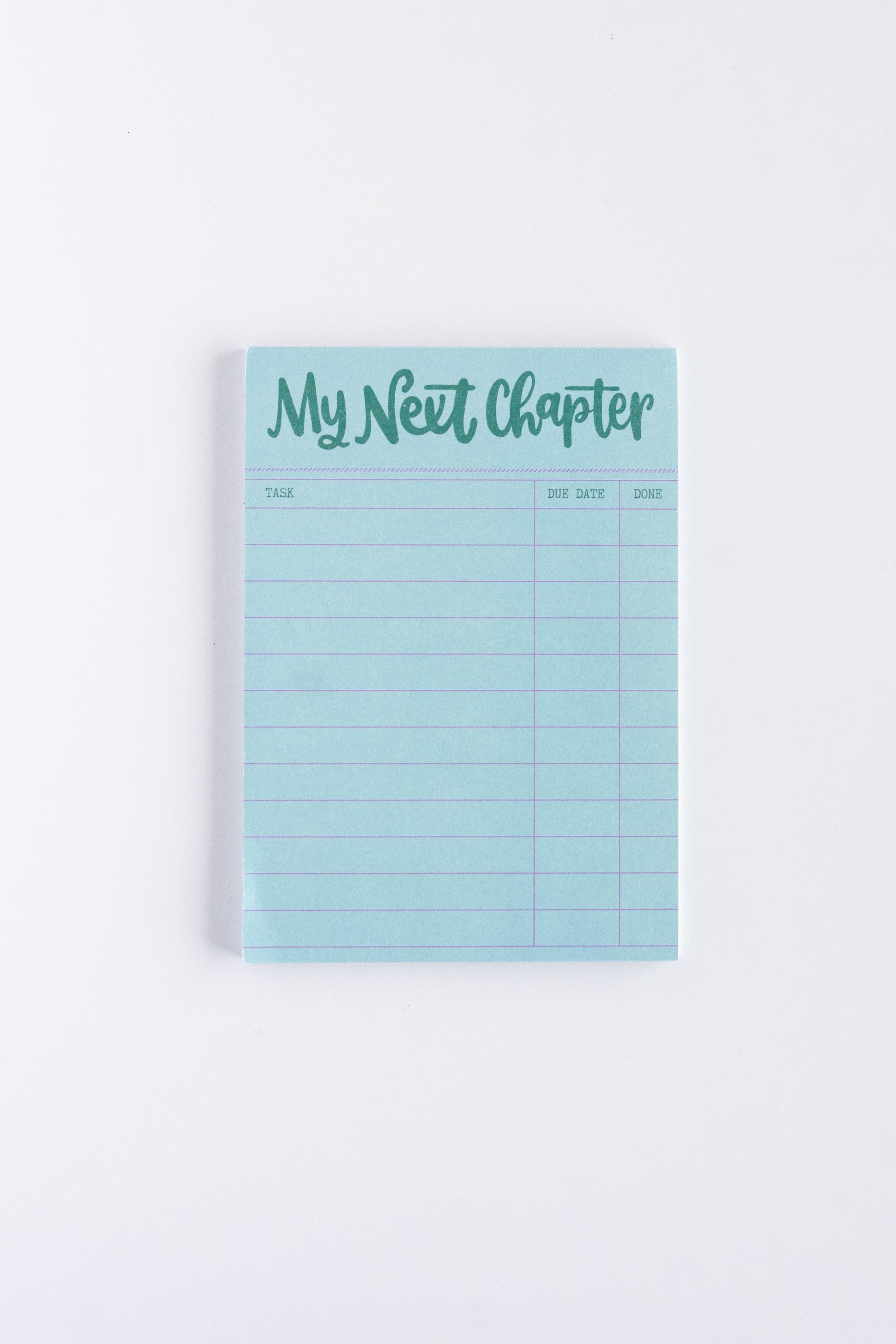 blue my next chapter notepad on white background